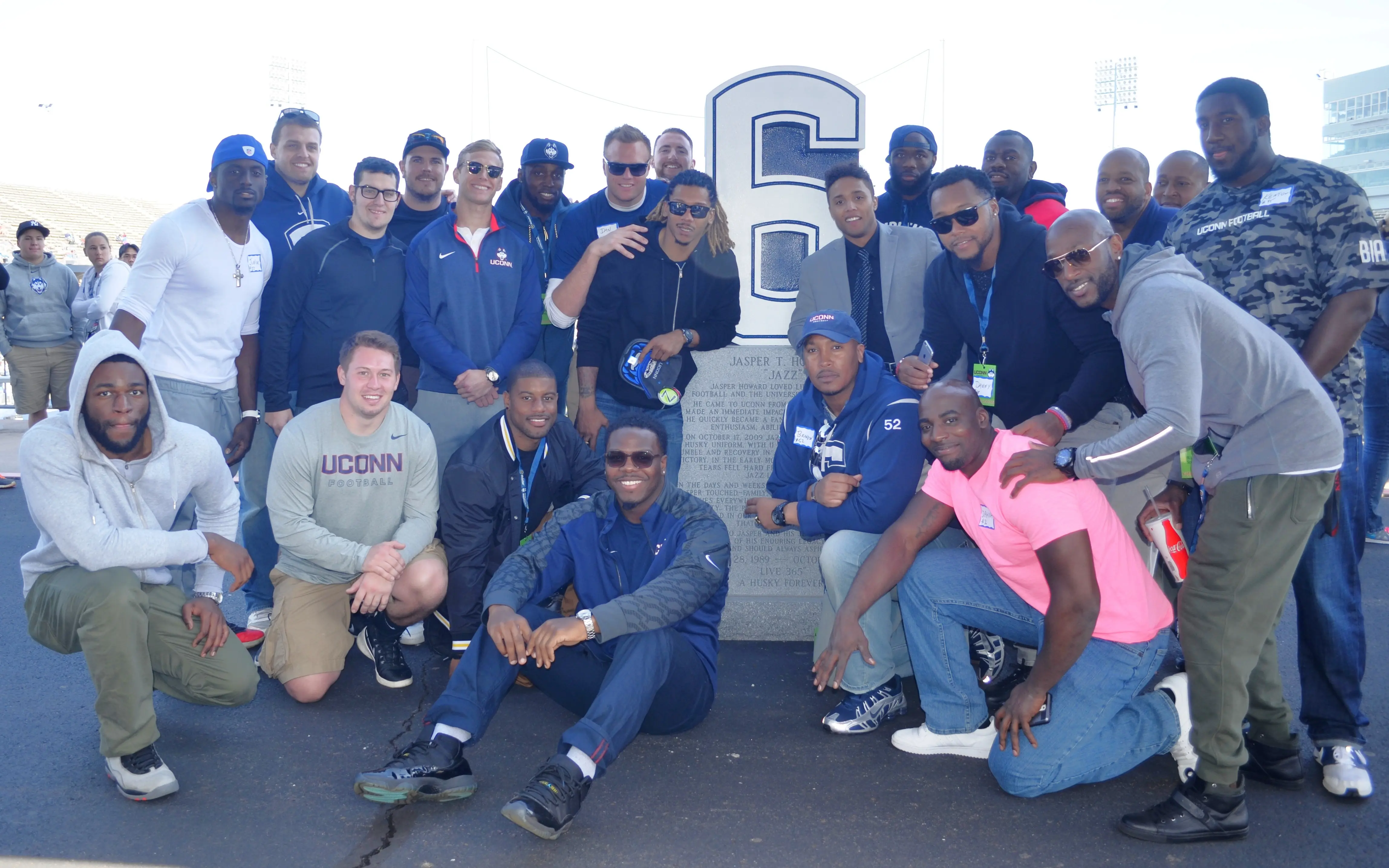 alumni reunion at Jazz statue without coach